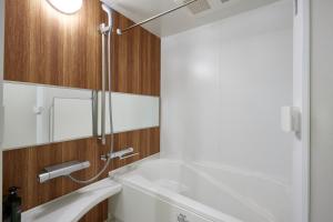 a bathroom with a sink and a mirror at COFFEE HOTEL Soundwave in Fujisawa +76 photos