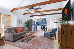 a living room with a couch and a ceiling fan at Lily Pad in Wimberley