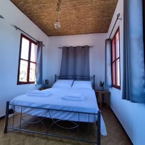 Ein Bett oder Betten in einem Zimmer der Unterkunft Rhodes Youth Hostel