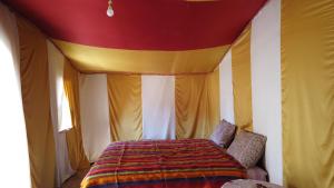 A bed or beds in a room at Chegaga Desert Trips