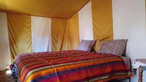 A bed or beds in a room at Chegaga Desert Trips