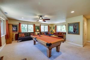 a living room with a pool table in it at Groveland Vacation Rental Near Pine Mountain Lake! in Groveland