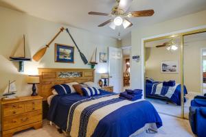 a bedroom with a bed and a ceiling fan at Groveland Vacation Rental Near Pine Mountain Lake! in Groveland