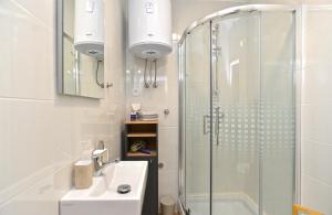 a bathroom with a shower and a sink at Apartment Loborika 1411 in Loborika +20 photos