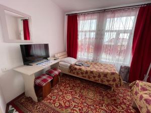 Postel nebo postele na pokoji v ubytování Guest House Ugra