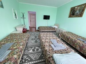 Postel nebo postele na pokoji v ubytování Guest House Ugra