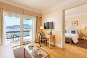 a hotel room with a bed and a desk at Grand Hotel Bristol Spa Resort, by R Collection Hotels in Rapallo