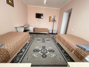 TV a/nebo společenská místnost v ubytování Guest House Ugra