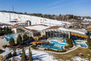 an aerial view of a ski resort in the snow at APARTAMENTS SKI KOTELNICA in Białka Tatrzańska