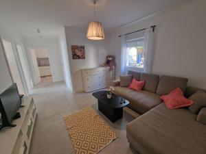 a living room with a couch and a television at Villa Biondina in Senj