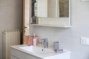 a bathroom with a sink and a mirror at Casa San Marco in Pisogne