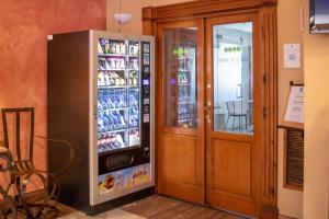 a soda machine next to a door in a store at YIT Vereda Real in Valencina de la Concepción