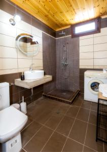 a bathroom with a sink and a washing machine at Casa Monte in Theológos +42 photos