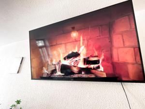 TV a/nebo společenská místnost v ubytování Zentrales Apartment mit TV, Küche und Mikrowelle