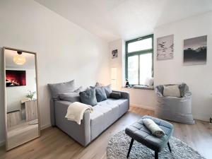 Posezení v ubytování Zentrales Apartment mit TV, Küche und Mikrowelle