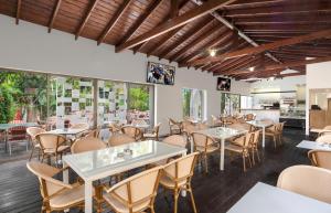 a dining room with tables and chairs at Legacy Hotel in Jerusalem