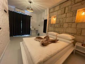 Postel nebo postele na pokoji v ubytování ALAÇATI XL LUXURY HOTEL
