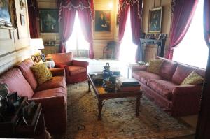 a living room with two couches and a table at Palazzo Lupis B & B Grotteria Calabria Italia in Grotteria
