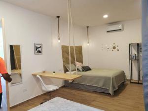 Postel nebo postele na pokoji v ubytování MaaR Estudio 7, a 2 cuadras del Malecón de La Paz