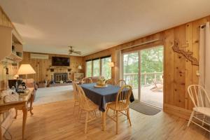 a kitchen and dining room with a table and chairs at Beautiful Chetek Home with Prairie Lake Access! in Chetek