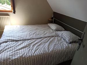 Un pat sau paturi într-o cameră la Paix éternelle