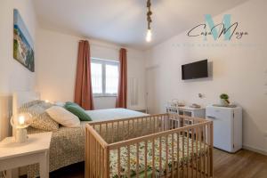 Postel nebo postele na pokoji v ubytování Casa Maya