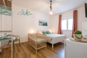 Postel nebo postele na pokoji v ubytování Casa Maya