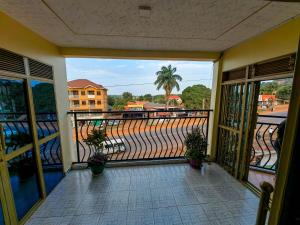 a balcony with a view of a street at Peace of Mind Suites in Entebbe