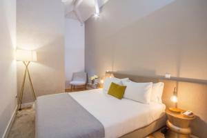 Postel nebo postele na pokoji v ubytování GuestReady - Ribeira luxury penthouse