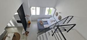 an overhead view of a living room with a staircase at Lemon Tree Houses in Áno Meriá
