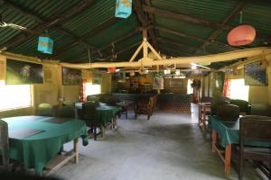 A restaurant or other place to eat at Wild Planet Eco Retreat