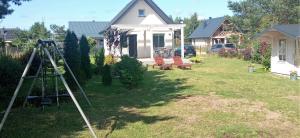 a camera in the yard of a house at Domek Na Ustroniu in Sasino