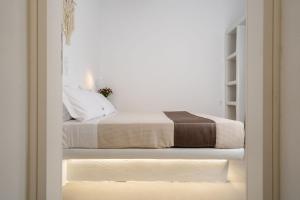 Postel nebo postele na pokoji v ubytování Bee Naxian House