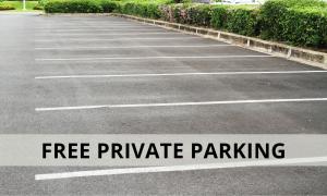 a parking lot with the words free private parking at Amsterdam Lake Hotel in Badhoevedorp