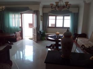 a living room with a couch and a table at إقامة الصداقة in Larache