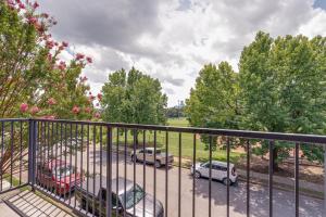 a balcony with cars parked in a parking lot at Historic Edgefield 2bd 2ba Loft in Nashville