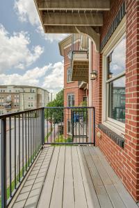 a balcony with a wooden deck and a window at Historic Edgefield 2bd 2ba Loft in Nashville