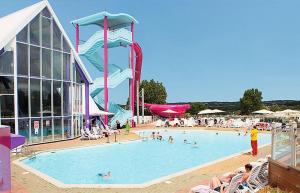 a large swimming pool with people in it at Combe Haven in Hastings