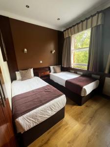 Postel nebo postele na pokoji v ubytování Garden View Hotel