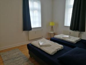 Postel nebo postele na pokoji v ubytování ERDGESCHOSS WOHNUNG BIS 10 PERSONEN ZENTRUM WINTERBERG