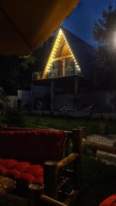 una casa con luces encima de ella por la noche en Sun House en Batumi