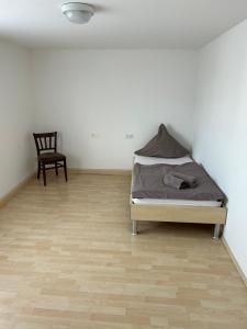 Un pat sau paturi într-o cameră la Ferienwohnung Cavallino 2