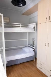 a bedroom with two bunk beds in a room at House 8 in Ermoupoli