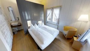 Łóżko lub łóżka w pokoju w obiekcie Klosterhotel St. Petersinsel