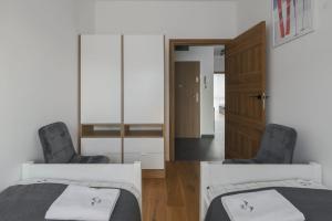 Posteľ alebo postele v izbe v ubytovaní Apartament 1N2 taras z widokiem - Sun&Sport