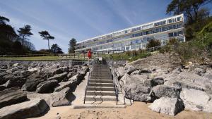 a building with stairs in front of a pile of rocks at Redcliffe Apartments G in Bishopston