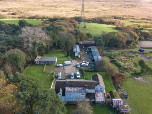 an aerial view of a farm with cars parked in a parking lot at -- Huge -- 5-bedroom home & Private Gym by Tailored Accommodation in Swansea