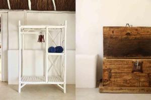 a white shelf with blue boxing gloves and a wooden box at Coco Tulum Hotel in Tulum