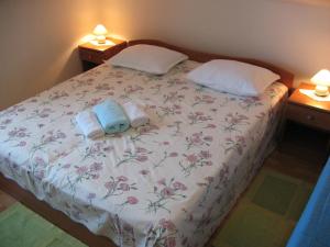 Postel nebo postele na pokoji v ubytování Apartments Niksa