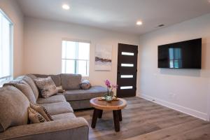 a living room with a couch and a table at 5079 Lotus Street in San Diego +19 photos